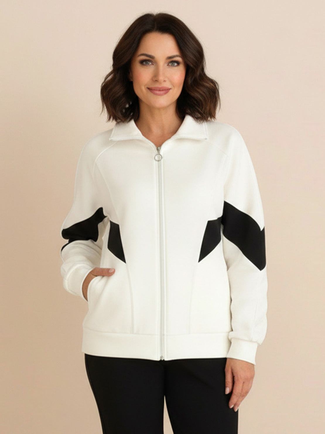 Woman wearing a Colorblock Comfort Tracksuit with slimming curved panels and relaxed fit