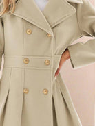 Tailored fit and flare trench coat with double-breasted buttons and smooth lining