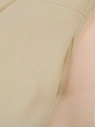 Tailored fit and flare trench coat with double-breasted buttons and smooth lining