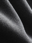 Close-up of soft dark grey lyocell-blend fleece fabric for hooded set