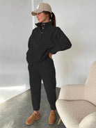 Black Warm & Easy Two-Piece Set featuring a relaxed pullover hoodie and matching pants with a soft, brushed interior ideal for casual, comfortable wear.