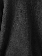 Oversized button-front knit cardigan with balloon sleeves and gold-tone buttons