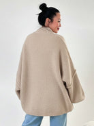 Oversized button-front knit cardigan with balloon sleeves and gold-tone buttons