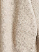 Oversized button-front knit cardigan with balloon sleeves and gold-tone buttons