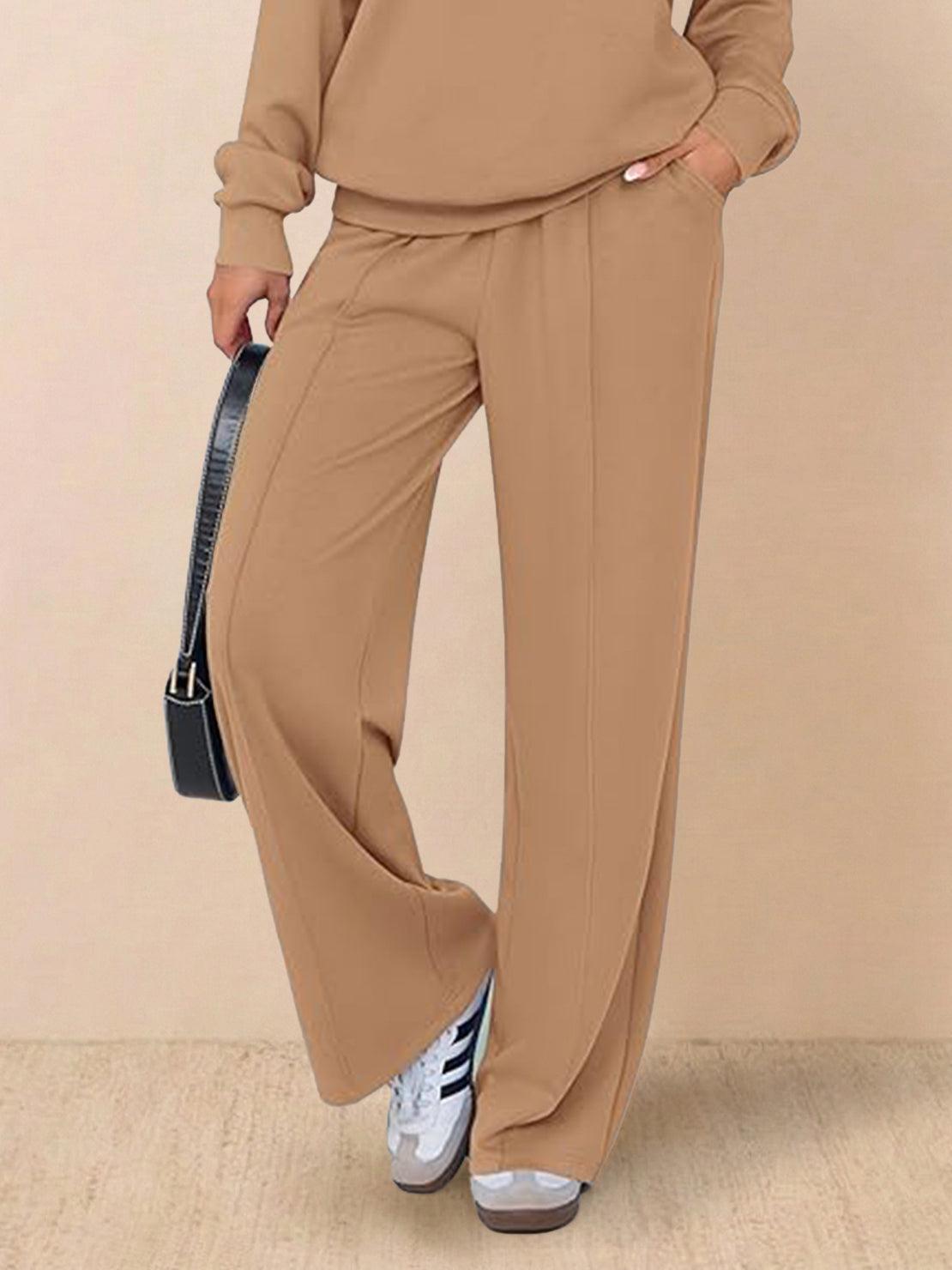 Two-piece wrinkle-free polo set with quarter-button top and high-waisted pants in breathable fabric