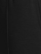 Soft knit wide-leg pants with elastic waistband and side pockets in breathable fabric