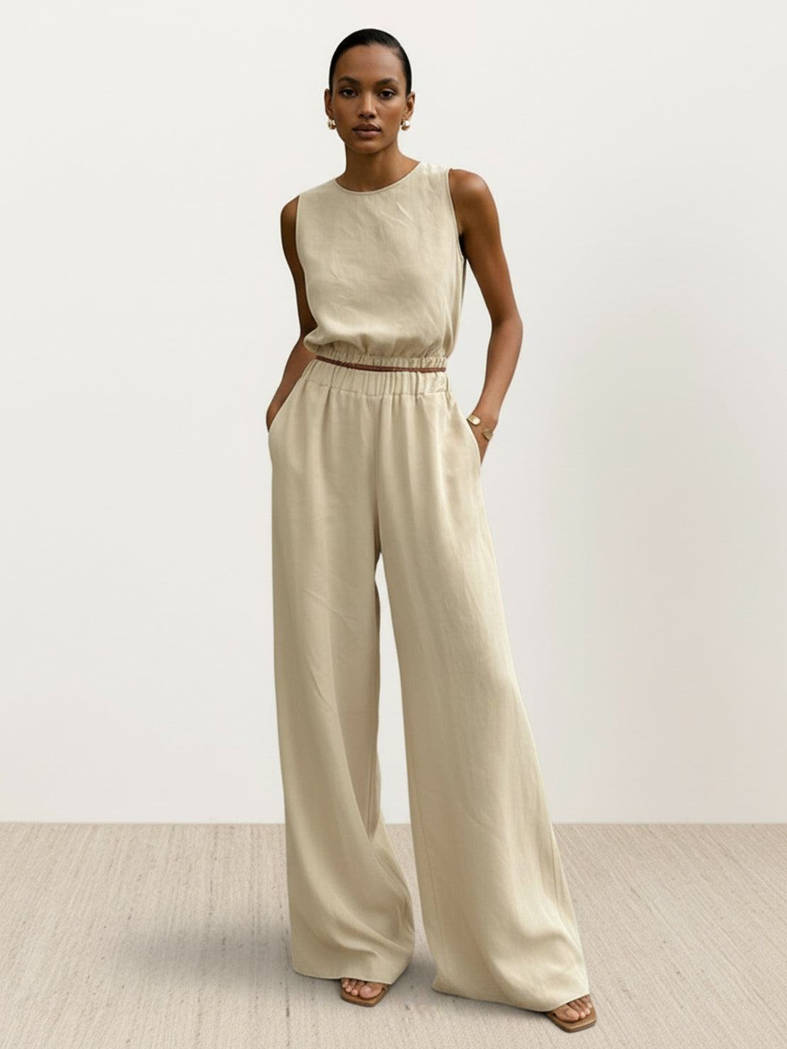 Lightweight linen-blend set featuring sleeveless top and wide-leg pants with side slits and elastic waistband