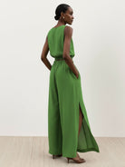 Lightweight linen-blend sleeveless top and wide-leg pants set with elastic waistband and side slits for breathability