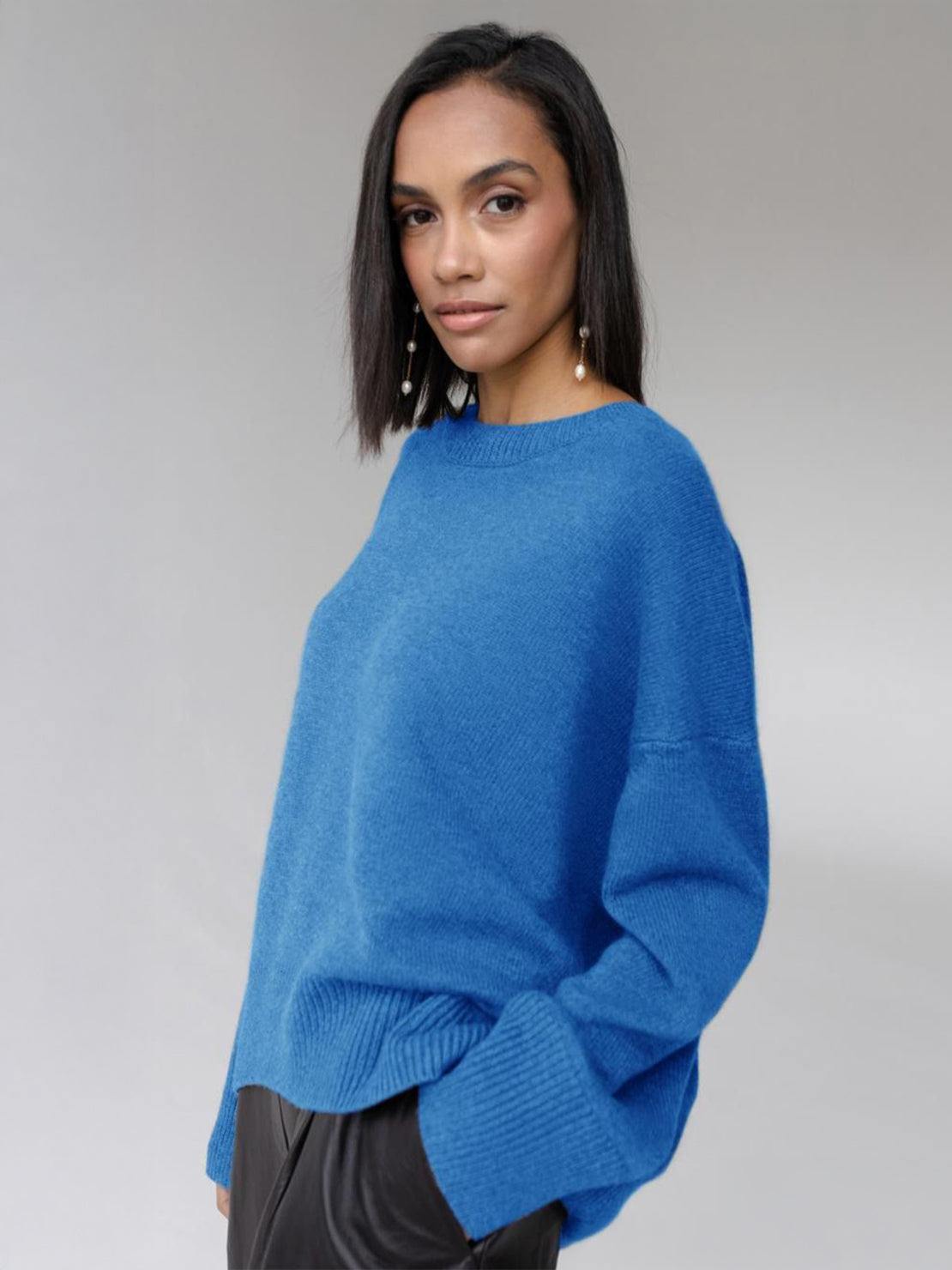 Oversized crew neck knit sweater with drop-shoulder sleeves and relaxed fit in neutral color