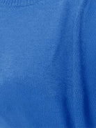 Oversized crew neck knit sweater with drop-shoulder sleeves and ribbed cuffs in neutral color