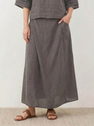 Two-piece 100% cotton wrap-front skirt and hip-length top set with crinkle texture and elastic waistband
