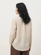 100% linen pinstripe shirt with loose fit and curved hem