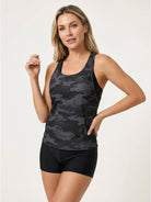 Three-piece open-back swim set with loose tank, printed racerback crop bra, and mid-rise boy shorts.