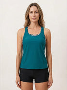 Three-piece open-back swim set with loose tank, racerback crop bra, and mid-rise boy shorts