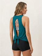 Three-piece open-back swim set with loose tank, racerback crop bra, and mid-rise boy shorts