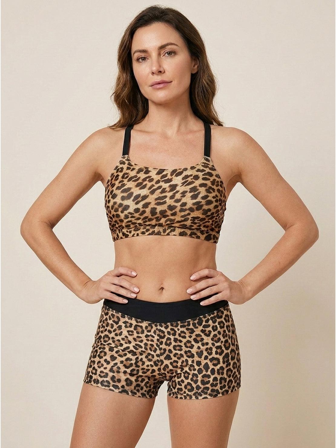 Three-piece open-back swim set with loose scoop-neck tank, racerback crop bra, and mid-rise boy shorts