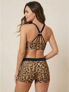 Three-piece open-back swim set with scoop-neck tank, racerback crop bra, and mid-rise boy shorts