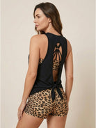 Three-piece open-back swim set with loose scoop-neck tank, racerback crop bra, and mid-rise boy shorts