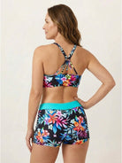 Three-piece open-back swim set with loose tank, racerback crop bra, and boy-short swim shorts.