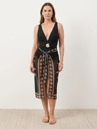 Deep-V swimsuit with ruched bust and waist, low open back, and sheer sun print sarong wrap