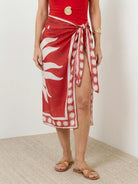 Deep-V one-piece swimsuit with ruching and sheer celestial print sarong wrap