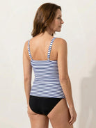 Black adjustable ruched tankini set with full-length side ruching and moderate coverage bikini bottoms