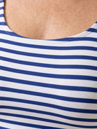 Black adjustable ruched tankini top with wide straps and matching classic black bikini bottoms