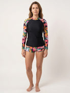 Tropical print two-piece rash guard set with long sleeves and boy-cut swim shorts