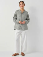 Oversized linen-cotton tang knot blouse with batwing sleeves and asymmetric hem