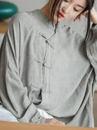 Oversized linen-cotton blouse with batwing sleeves and knotted frog button closures