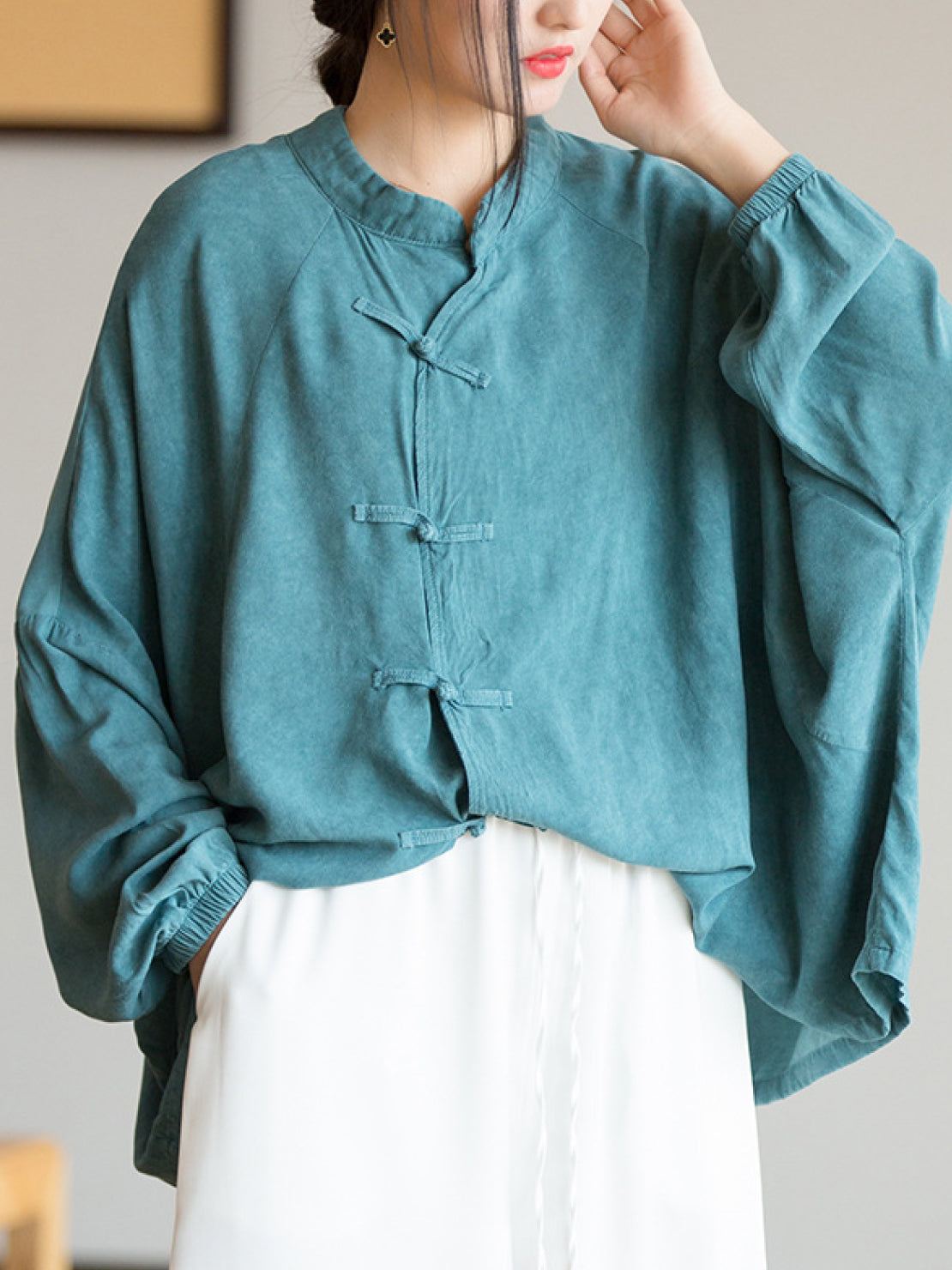 Oversized linen-cotton blouse with batwing sleeves and knotted frog buttons