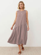 Cotton-linen summer midi dress with tiered skirt and relaxed drop-waist silhouette in natural fabric