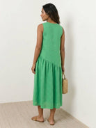 Lightweight cotton-linen summer midi dress with tiered skirt and relaxed drop-waist silhouette in white