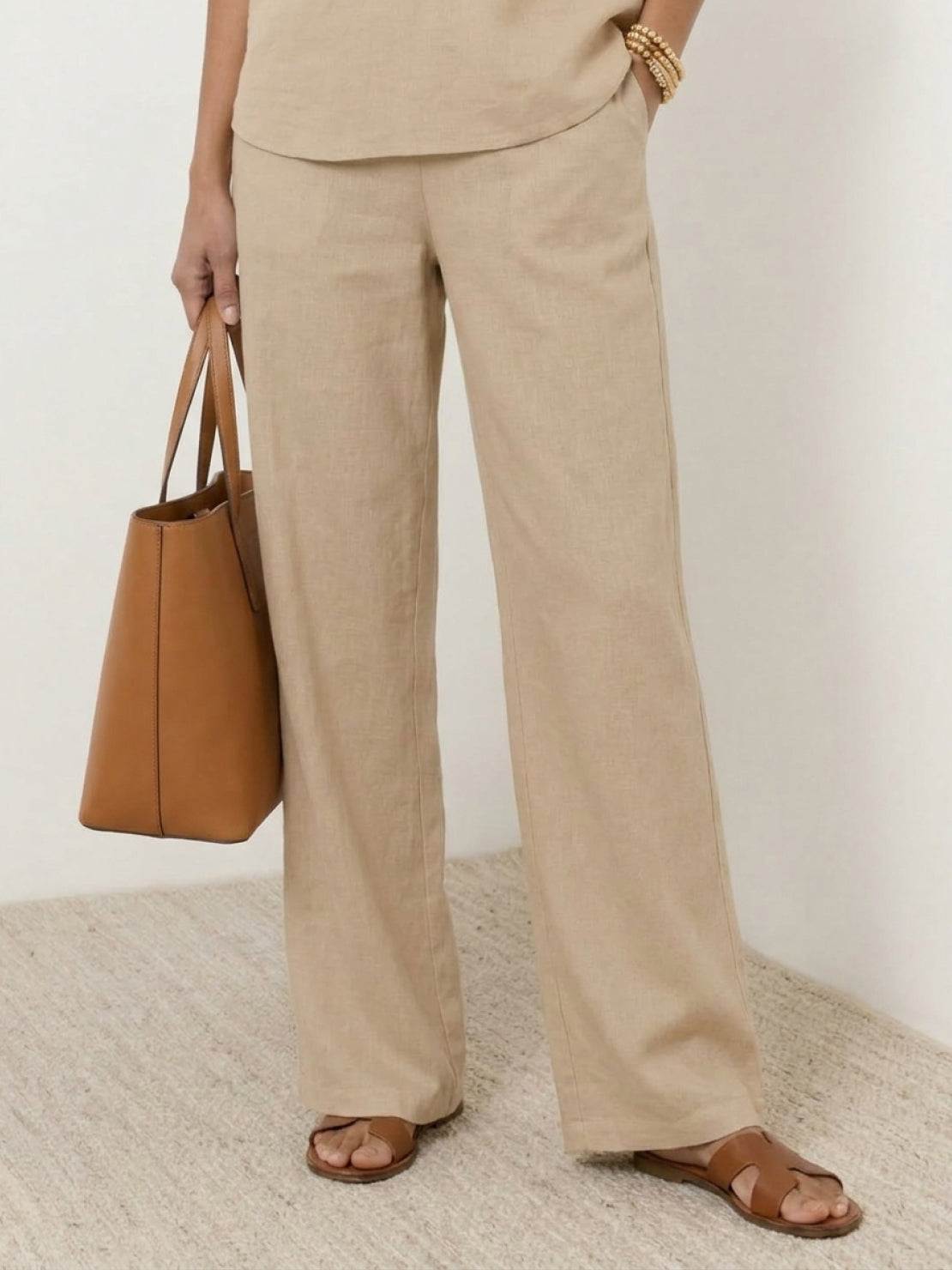 Lightweight linen top with V-neck and button detail in relaxed boxy shape for mature women