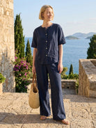 100% cotton two-piece set with button-front top and wide-leg pants in soft solid colors