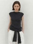 Knit vest with attached scarf in fine ribbed knit showcasing versatile styling options