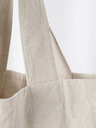 Beige cotton linen canvas shoulder bag with front pocket and comfortable straps for everyday use