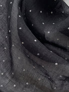 Lightweight 100% linen neck scarf with timeless checkered pattern and natural rolled edges for versatile styling