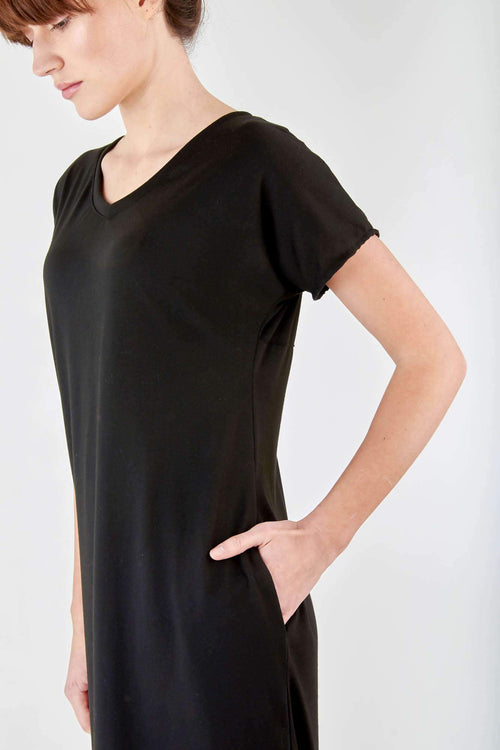 Black side slit maxi dress with V-neck, roll sleeves, and discreet pockets in soft cotton blend fabric