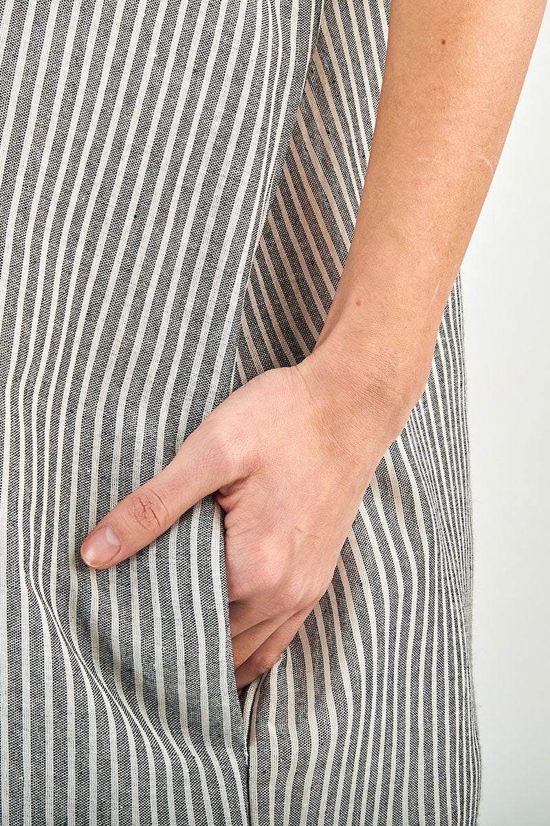Close-up of hand in pocket on striped linen blend gauze shirt dress fabric