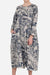 Woman wearing a loose fit Japanese Porcelain Print midi dress with 3/4 sleeves and two front pockets