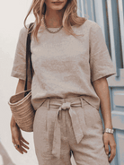 three-piece cotton-linen set with relaxed top and straight-leg pants in monochrome tones