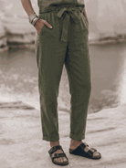 Woman wearing relaxed cotton-linen set with short-sleeve top and straight-leg pants in monochrome tones