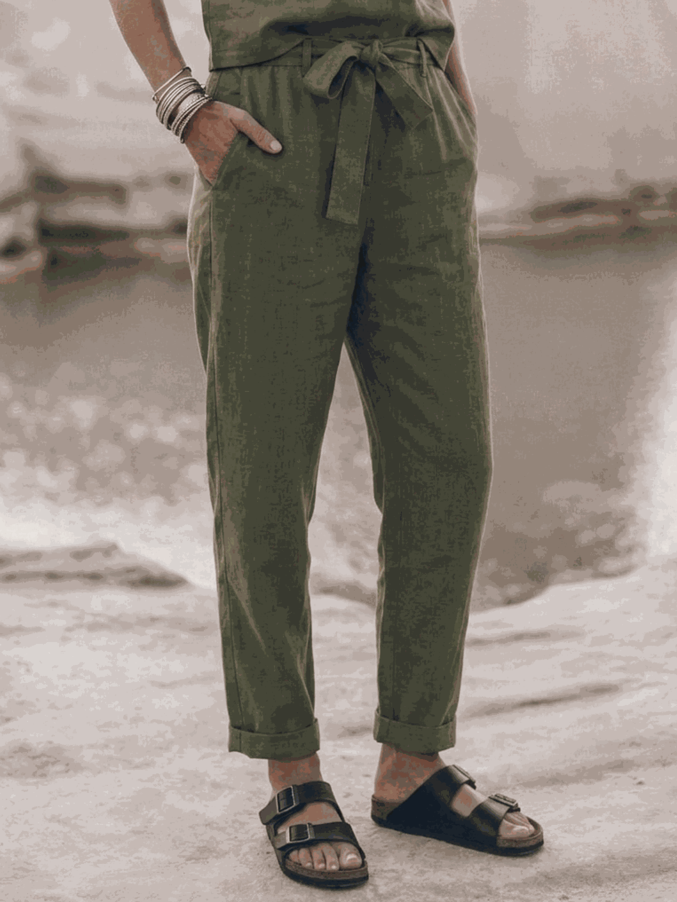 Woman wearing relaxed cotton-linen set with short-sleeve top and straight-leg pants in monochrome tones