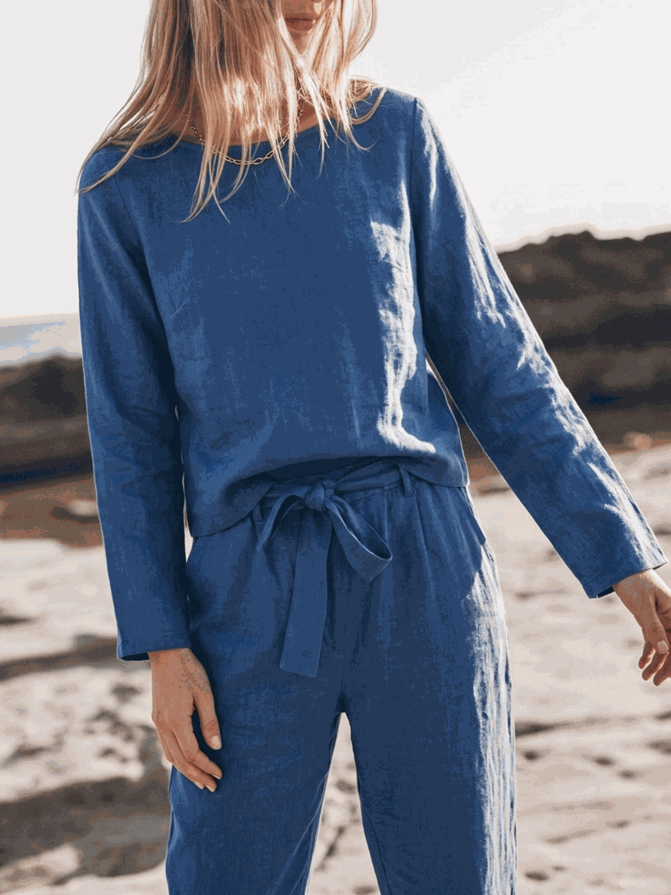woman wearing relaxed cotton-linen set with short-sleeve top and straight-leg pants in monochrome tone