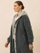 Woman wearing gray everyday wear oversized sherpa long coat with cozy sherpa lining and relaxed stylish silhouette