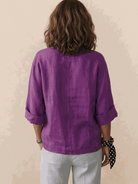 White pure linen age-defying shirt with button detail on mannequin