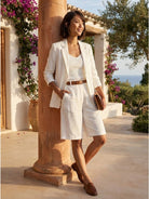 Women's blazer and high-waisted shorts two-piece set in stylish monochrome design
