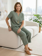 Woman wearing breezy cotton blend two-piece set against white background