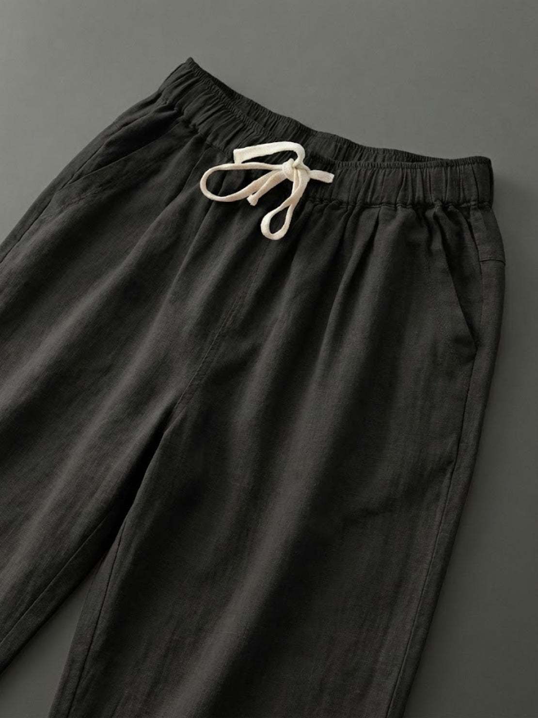 Woman wearing breezy relaxed fit straight pants in casual stylish setting